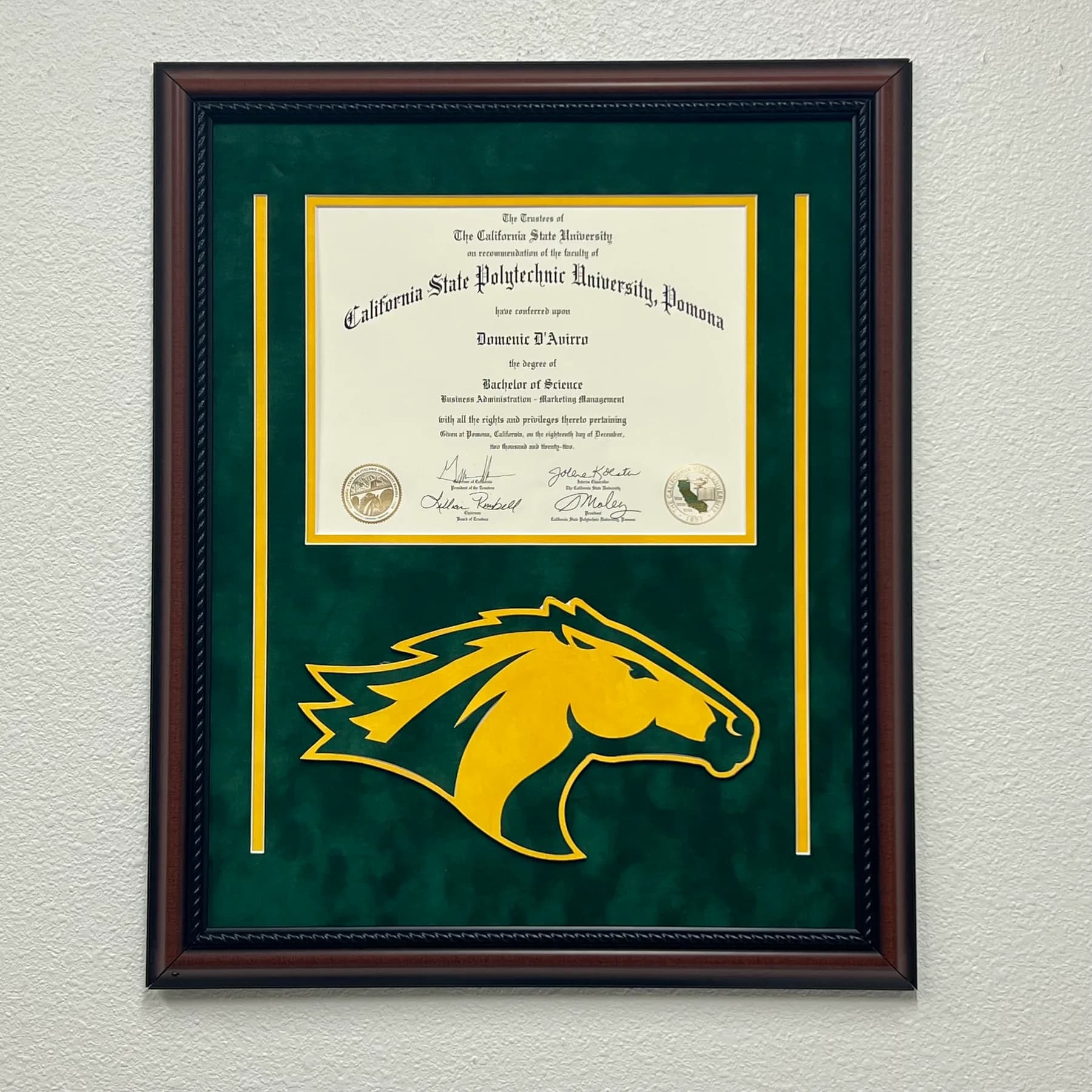 A diploma custom-framed by The Framing Collective in Newport Beach